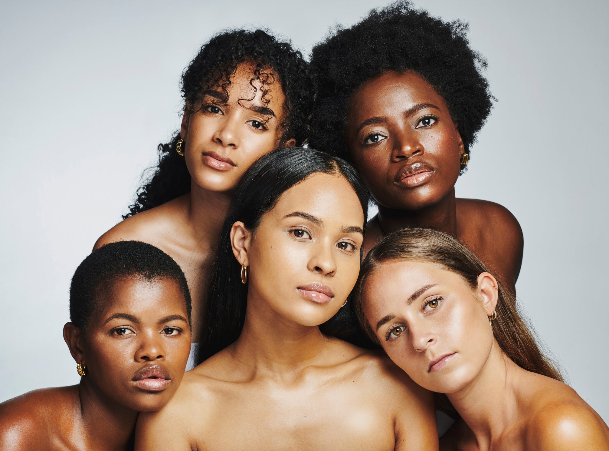 five women of diverse backgrounds with no makeup