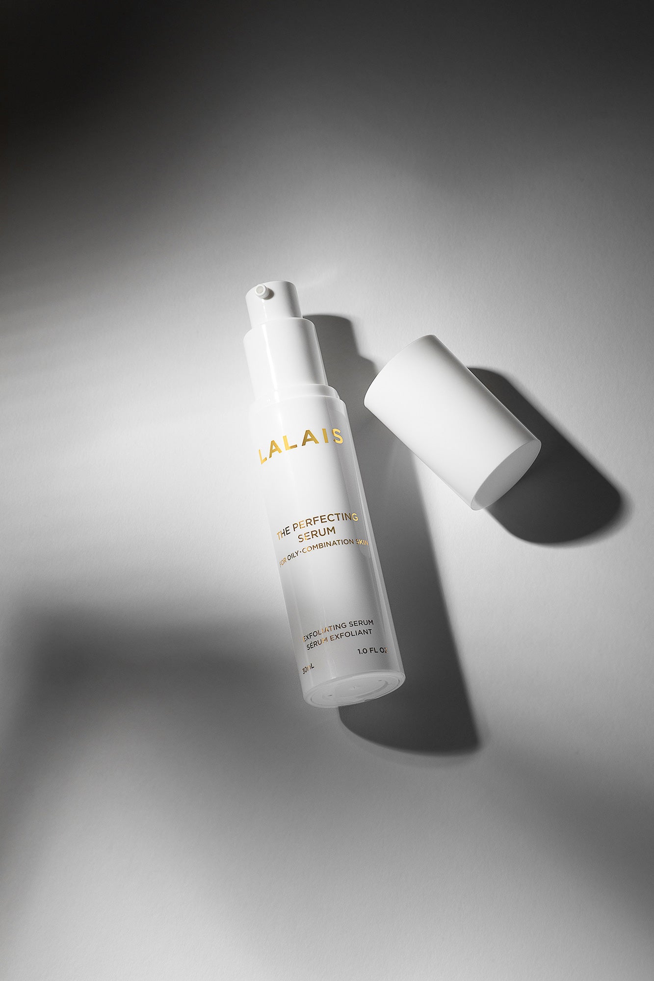 Lalais perfecting serum product shown on a gray background