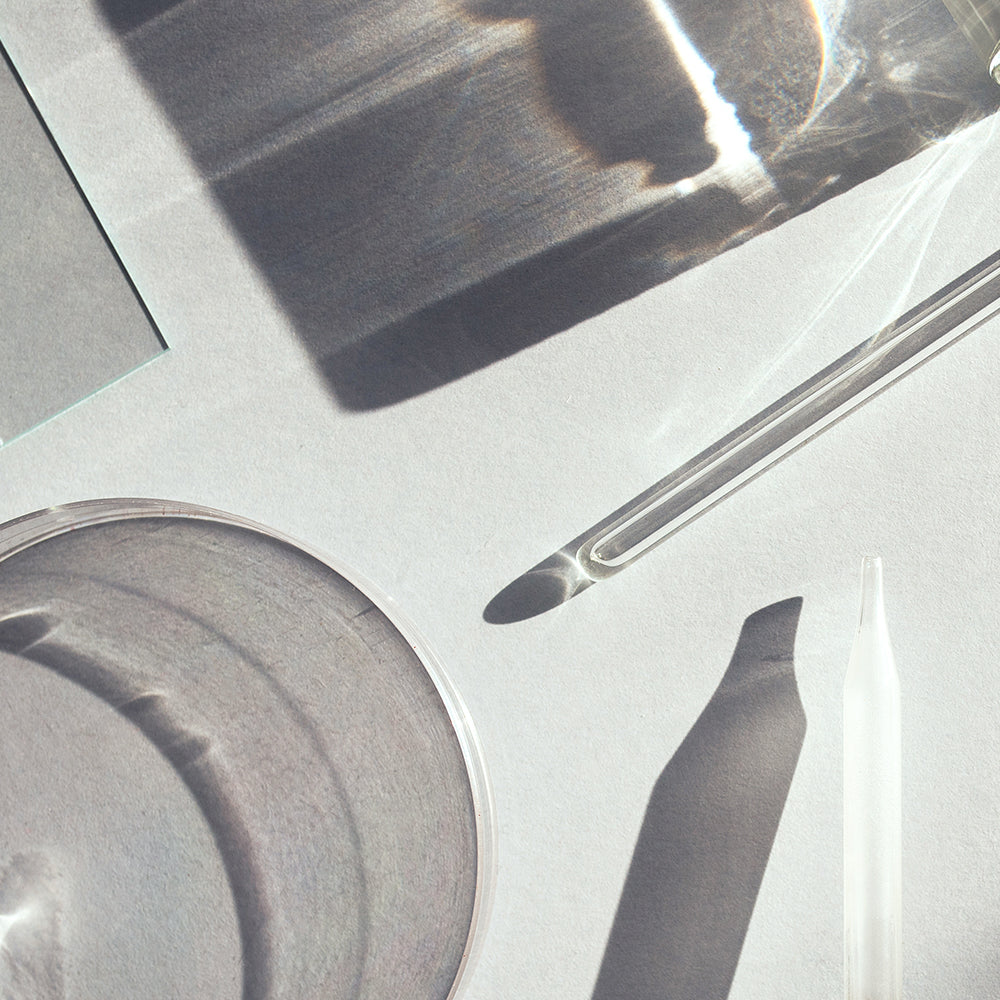 clean clear glass lab items on a white background