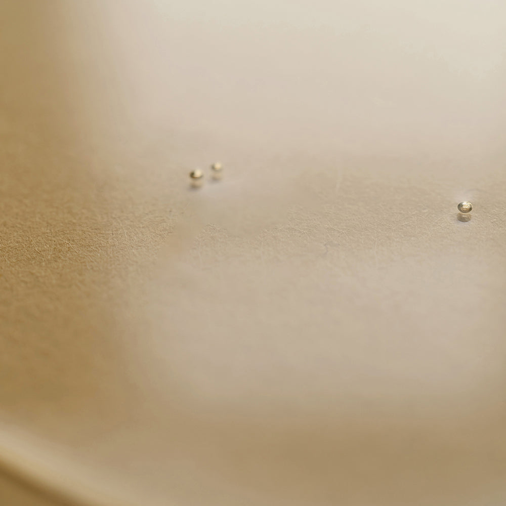 golden colored background with three small floating bubbles